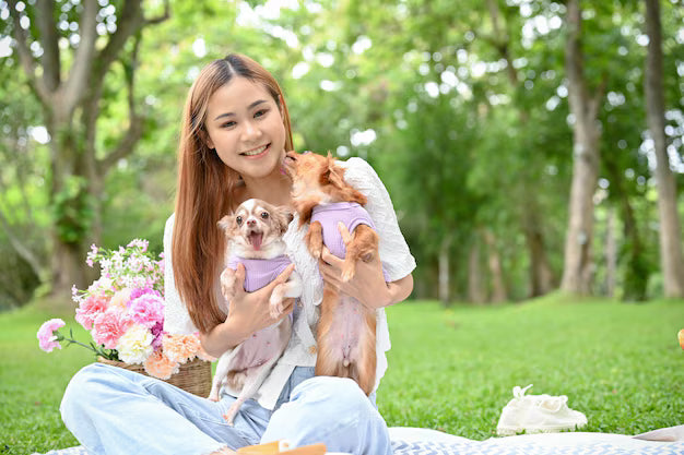 files/beautiful-young-asian-woman-picnic-garden-with-her-lovely-dogs_67155-23903.avif