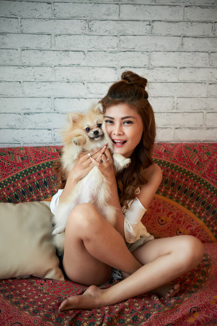 files/cheerful-young-asian-woman-sitting-couch-home-holding-small-dog_1098-20158.avif